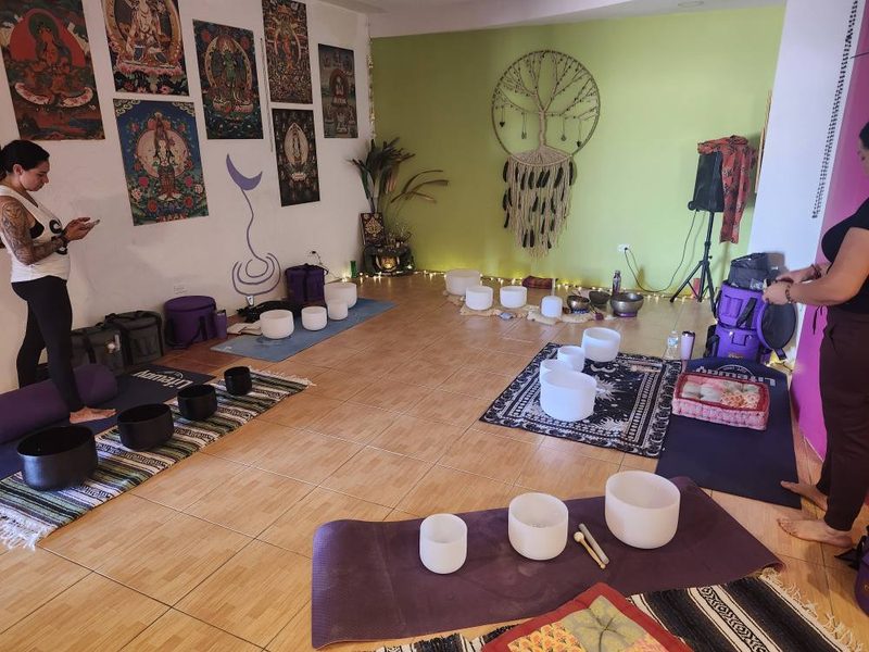 Sound healing setup with crystal and Tibetan singing bowls at Shakti Rising